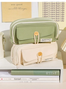 Detail of large canvas pencil case with wooden button flap and spacious zipper compartment