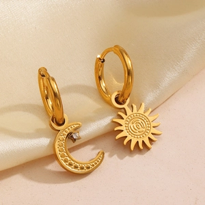 Minimalist gold sun and crescent moon asymmetric earrings with zircon accents
