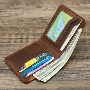 Macro view of vintage brown crazy horse leather wallet with hand-stitched details