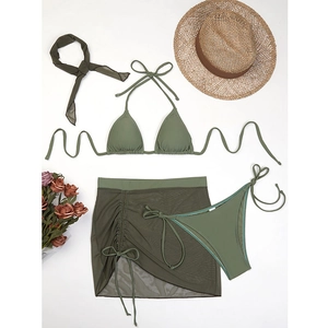 Detailed flat lay of olive green three-piece bikini set with mesh skirt and chiffon scarf
