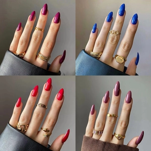 Chic medium-length press-on nails in solid colors with assorted gold fashion rings
