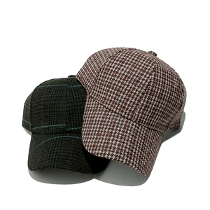 Classic houndstooth wool baseball cap in brown and dark green plaid with a curved brim