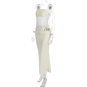 Detail of cream lace strapless top and slim fit skirt with side ruching on model