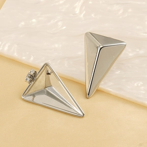 Polished silver stainless steel triangular pyramid earrings with butterfly backs on silk