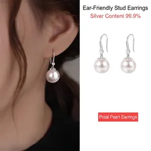 Ohrringe aus 999 Sterlingsilber mit Perlen, Metallblättern und funkelnden Kristallen