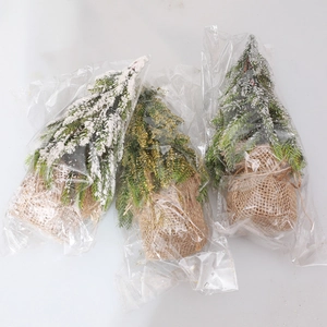 Mini flocked Christmas trees with burlap base and gold silver glitter decorations