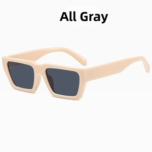Detail view of retro square beige plastic sunglasses with solid dark grey lenses