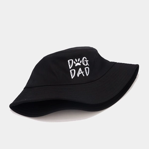 Black cotton bucket hat with white DOG DAD embroidery and paw print on white background