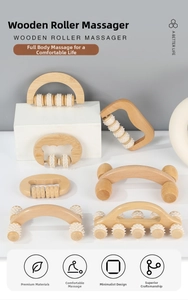 Verschiedene hölzerne Handmassage-Roller mit weißen Zahnrädern zur Körperentspannung