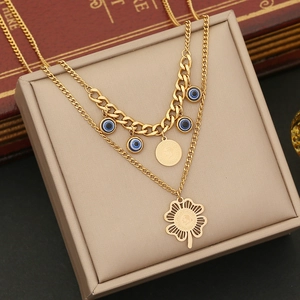 Double-layer gold stainless steel necklace with blue evil eye charms and clover pendant