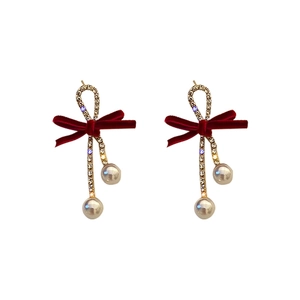Red velvet bow earrings with gold plating and imitation pearl drops for festive events