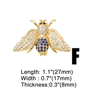 Detailed view of a gold bee charm with blue stones and precise measurements 27x17mm