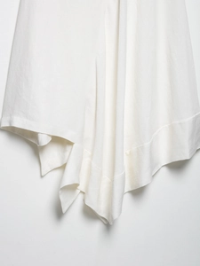 Detailed view of white acetate satin fabric texture with soft drapery and clean seams