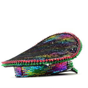 Detailed macro shot of iridescent sequins and sharp metallic studs on a punk party captain hat