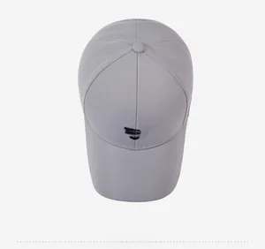 Top view of light grey baseball cap with black geometric arrow embroidery and six panels