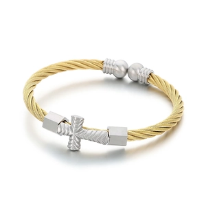 Twisted steel wire bracelet with a silver cross and gold-tone woven cable design