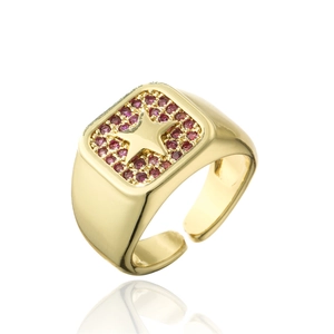 Macro shot of 18K gold plated ring with red zircon inlay and star pattern detail