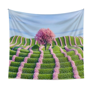 Bohemian dreamscape wall tapestry featuring a cherry blossom tree and green hills landscape