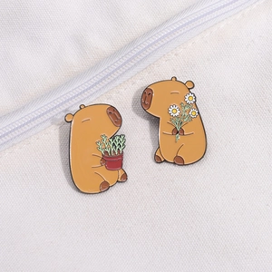 Cute Capybara enamel pin set featuring two pins with flowers on white canvas background
