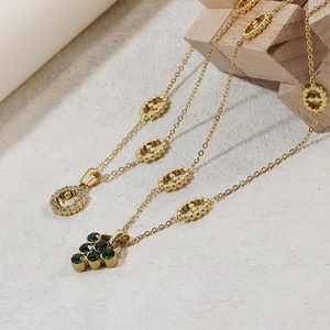 Retro gold necklace set with hollow diamond smile pendant and green gemstone charm