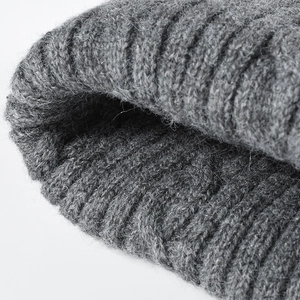 Grey ribbed knit beanie hat featuring thick warm yarn and premium textured wool fabric