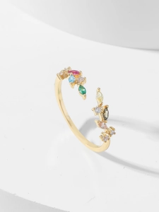 Close-up of adjustable gold leaf ring featuring colorful marquise-cut zircon stones