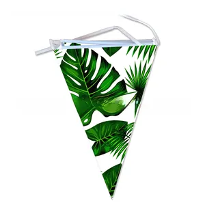Detail of 10 tropical leaf pennant banners with white string for summer party decor