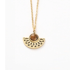 Detailed view of fan-shaped stainless steel pendant with round brown natural stone inlay