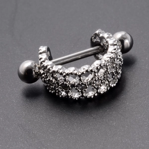 Macro detail of silver barbell stud featuring micro-paved cubic zirconia crystals