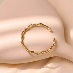 Minimalist gold twisted spiral open cuff bracelet with vintage geometric wave design