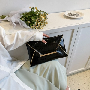 Elegant black crocodile texture envelope clutch bag with gold metal trim for parties