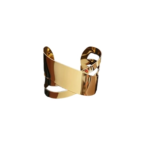 Minimalist wide cross cuff bracelet in gold finish with a high polished mirror surface