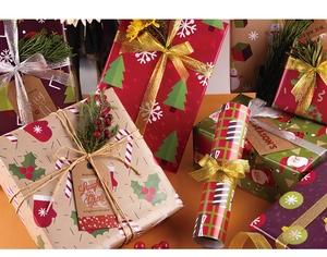 Festive Christmas wrapping paper set with ribbons, tags, pine branches and berries