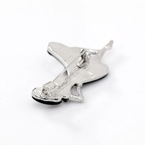 Silver metal dancing girl brooch back view with shell inlay and secure safety pin clasp