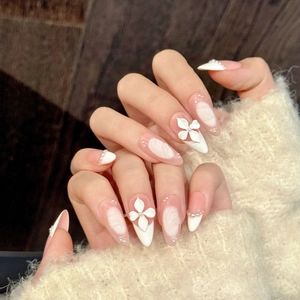 Handmade almond press-on nails with 3D white flower carving, pearls and French wave patterns