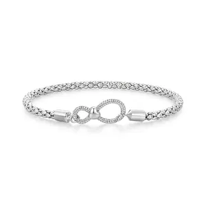925 sterling silver infinity knot chain bracelet with small heart detail on white background