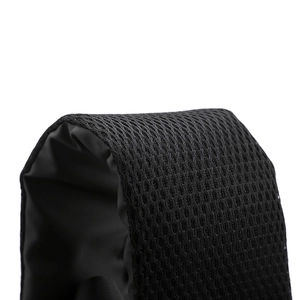 Detailed macro view of breathable honeycomb mesh padding on the black chest bag strap