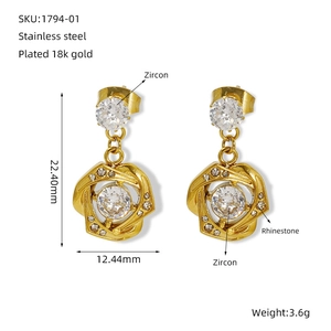 Detail view of 18k gold plated stainless steel earrings with zircon and rhinestone dimensions
