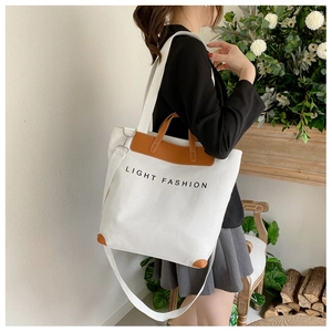 White canvas tote bag with brown leather straps and Light Fashion print for women
