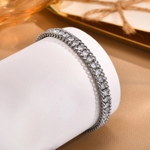 Detail of silver chain bracelet featuring a row of sparkling round cubic zirconia stones
