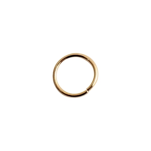 Close-up of golden metal jump rings for DIY jewelry and hair braid accessories
