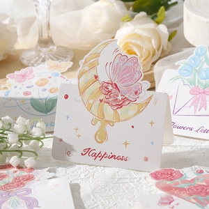 Detail of floral happiness greeting card with crescent moon, roses and lilies of the valley