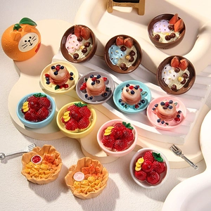 Miniature resin dessert fridge magnets including colorful DIY food models on display