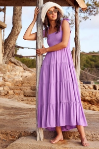 Detail of purple tiered maxi dress with tie-up straps and polka dot jacquard texture