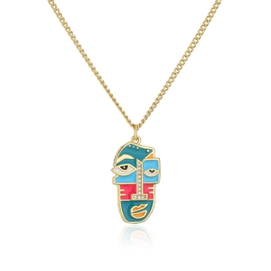 Macro shot of abstract face pendant with colorful enamel and zircon on gold necklace