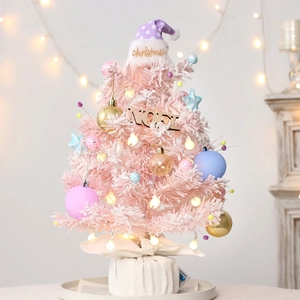Rotating macaron pink flocked Christmas tree with ornaments and Noel wooden sign