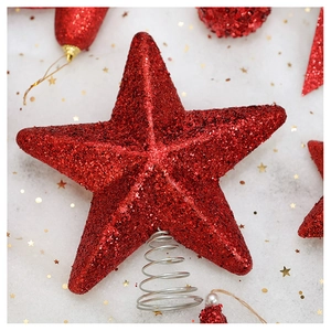 Close-up of sparkling red star Christmas tree topper with glitter and metal spring base