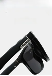 Detail shot of black polarized sunglasses showing silver logo and high-elastic frame hinge
