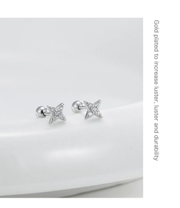 Detailed view of gold plated star stud earrings with cubic zirconia and screw back