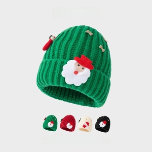 Detailed view of Christmas knit hats with Santa patches and gold bows in four colors